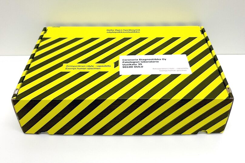 Coronaria diagnostiikan lähetyspaketti, joka on keltamusta raitainen.