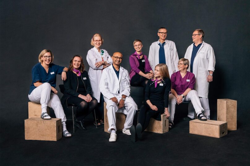 silma aseman ammattilaisia ryhmakuvassa