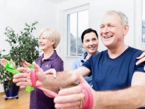 Older patients in physiotherapy using power band for strength training