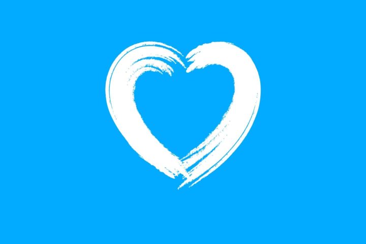 Coronarian valkoinen sydän sinisellä taustalla.